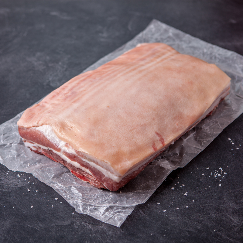 A raw pork belly joint