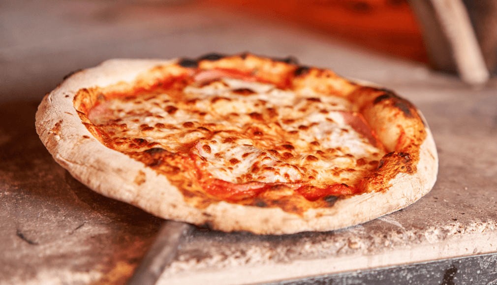 Pizza from a pizza oven, local ingredients, cheese and tomato pizza